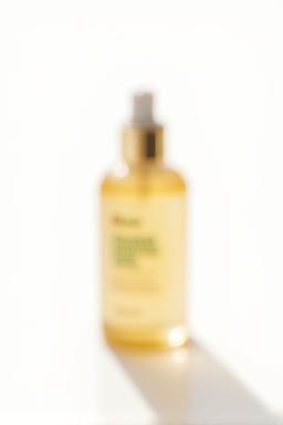 Hair serum bottle on white background